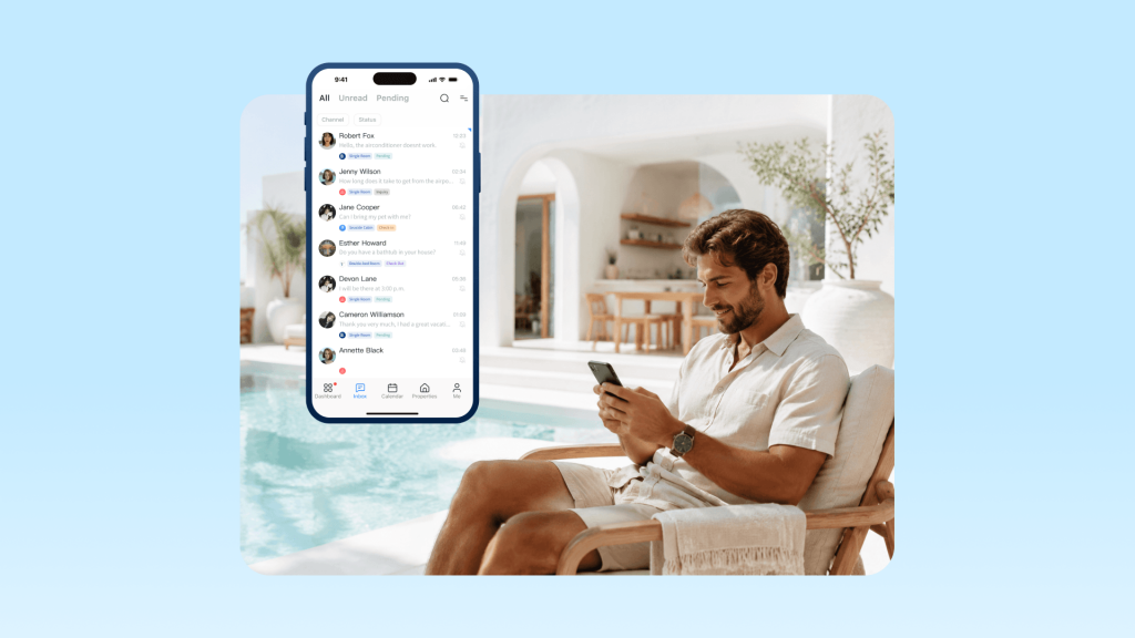 An Airbnb host sitting by the pool, replying to guest messages on his phone.
