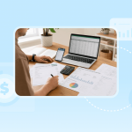 An Airbnb host doing revenue management at their desk, with various spreadsheets, a computer, and a phone on the table.